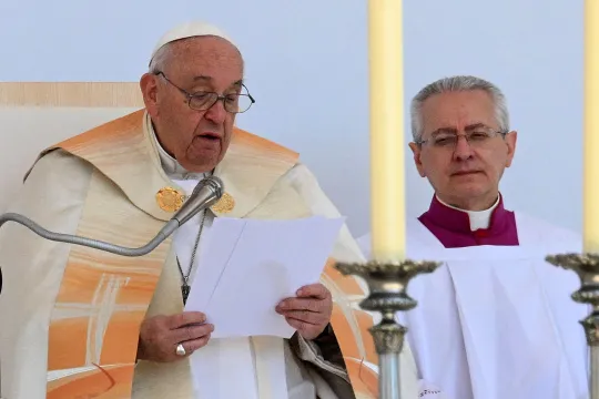 Pope Francis (L) celebrates a holy mass at Kossuth Lajos' Square during his visit in Budapest on April 30, 2023, the last day of his tree-day trip to Hungary. Vincenzo PINTO / AFP