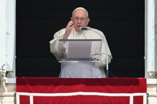 Pope Francis blesses attendees from the window of the apostolic palace overlooking St. Peter's square during the Regina Coeli prayer on May 14, 2023 in The Vatican. Tiziana FABI / AFP