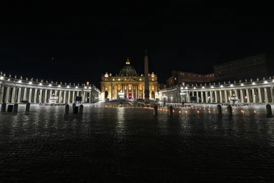 A general view shows St. Peter's Square as Pope Francis (Rear C) leads the celebration of the Way of the Cross (Via Crucis) as part of Good Friday on April 2, 2021 in the Vatican, during the Covid-19 coronavirus pandemic. ANDREAS SOLARO / AFP