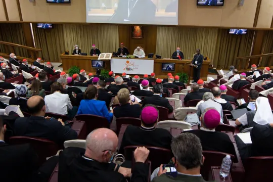 This handout picture taken and released on October 9, 2021 by Vatican Media shows Pope Francis (C) during the opening of the Synod at the Vatican. 