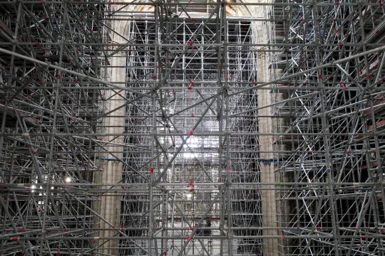 This aerial view taken on September 16, 2021, shows scaffolding in Notre-Dame de Paris, in Paris, more than two years after the blaze that made the spire collapsed and destroyed much of the roof, in Paris on April 15, 2021. The phase of securing and consolidating the cathedral Notre-Dame de Paris, ravaged more than two years ago by fire, has ended, giving way to the restoration phase, announced on September 18, 2021, the public institution responsible for its conservation.