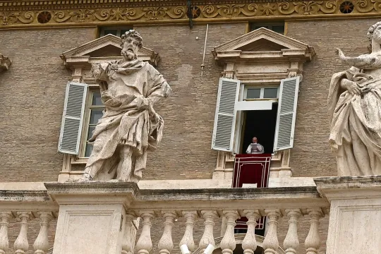Pope Francis addresses the crowd from the window of the apostolic palace overlooking St.Peter's square during his Sunday Angelus prayer at the Vatican on June 20, 2021. 