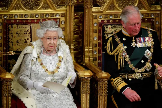 Britain's Queen Elizabeth II (L) sits with Britain's Prince Charles, Prince of Wales on the Sovereign's throne in the House of Lords as she delivers the Queen's Speech at the State Opening of Parliament in the Houses of Parliament in London on October 14, 2019. The State Opening of Parliament is where Queen Elizabeth II performs her ceremonial duty of informing parliament about the government's agenda for the coming year in a Queen's Speech. TOBY MELVILLE / POOL / AFP