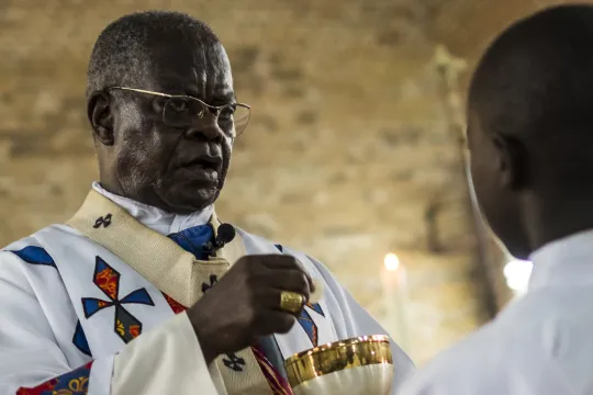 In this file photograph taken on September 21, 2016, Cardinal Laurent Monsengwo Pasinya, Archbishop of Kinshasa, hands out Communion bread during a Catholic mass in Kinshasa to mourn the victims of the violent clashes of the last few days. The influential Archbishop Emeritus of Kinshasa, capital of the Democratic Republic of the Congo, Cardinal Laurent Monsengwo Pasinya, died on July 11, 2021 in Paris at the age of 81, six days after his evacuation in "critical condition", the AFP learned from a religious s