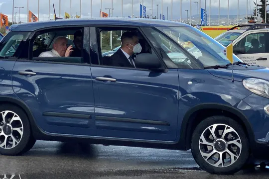 Pope Francis leaves in a car upon his arrival in Athens airport on December 4, 2021. Pope Francis began a landmark trip to Greece with the first visit to Athens by a pontiff in two decades, aiming to improve relations with the Orthodox Church of Greece and highlight the plight of refugees.
