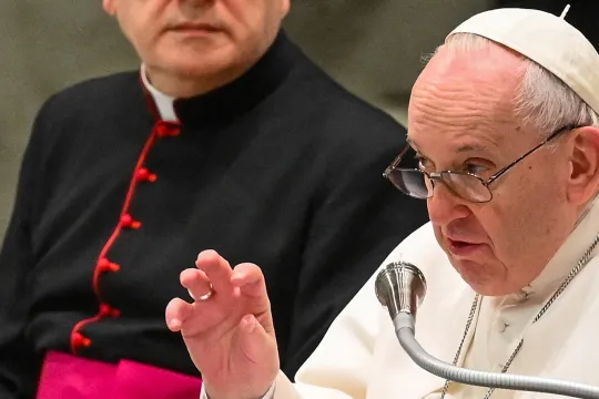 ope Francis, flanked by Monsignor Leonardo Sapienza (L), holds his weekly general audience at the Paul VI hall in the Vatican on February 9, 2022.
