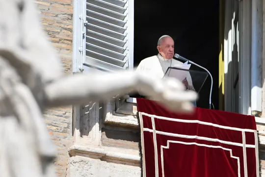 Pope Francis speaks from the window of the apostolic palace during the weekly Angelus prayer on March 20, 2022 in the Vatican. 