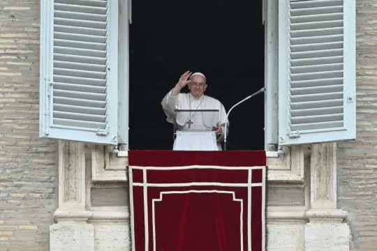 Pope Francis waves from the window of the apostolic palace upon his arrival for the Regina Coeli prayer on May 8, 2022 in The Vatican. 