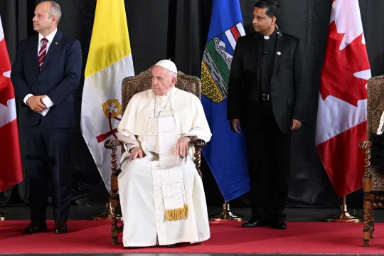 Pope Francis (C) and Canadian Prime Minister Justin Trudeau (L) take part in a welcoming ceremony for the Pope at Edmonton International Airport in Alberta Providence, Canada, on July 24, 2022. Pope Francis visits Canada for a chance to personally apologize to Indigenous survivors of abuse committed over a span of decades at residential schools run by the Catholic Church.