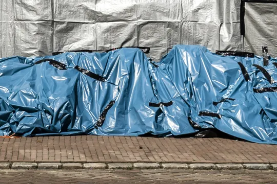 Zandzakken in het geevacueerde Arcen. De hevige regenval en overstromingen in Noord-Limburg hebben voor veel schade gezorgd.