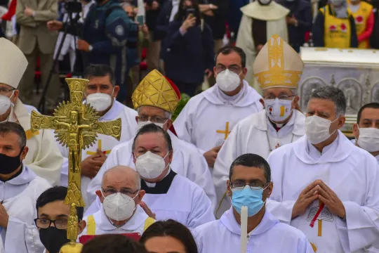 Catholic faithfuls attend a mass after the arrival of the relic of Paraguayan Carmelite nun Maria Felicia de Jesus Sacramentado, popularly known as Chiquitunga, at Silvio Pettirossi International Airport in Luque, Paraguay on Setember 21, 2021. Pope Francis approved the beatification of Chiquitunga (1925-1959) in March 2018.