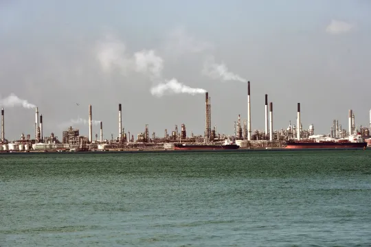 Smokes rises out of chimneys from a Shell oil refinery on Pulau Bukom