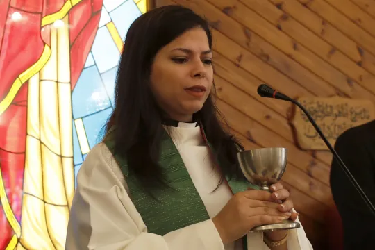 First Palestinian female lutheran pastor Sally Azar (C) celebrates her first holy mass at the Lutheran church in the West Bank town of Beit Sahour, near Bethlehem, 29 January 2023. Sally Azar, was ordainted on 22 January 2023, and became the first Palestinian female lutheran pastor at the Lutheran Church in the Holy Land with about three thousand followers in Jerusalem, the West Bank and Jordan. EPA/ATEF SAFADI