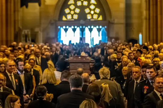 A handout taken on February 2, 2023 for The Catholic Weekly by Giovanni Portelli shows a coffin containing the remains of late Australian Catholic Cardinal George Pell being carried out of St. Mary's Cathedral during his funeral in Sydney. Giovanni Portelli / AFP
