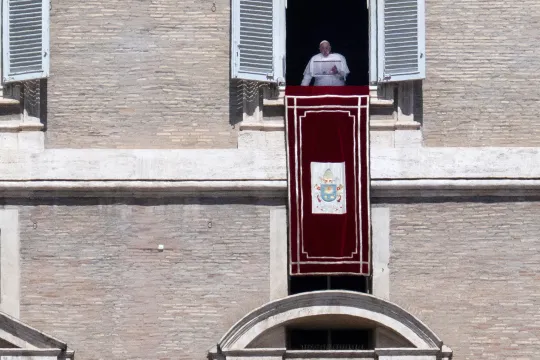 Pope Francis speaks from the window of the apostolic palace overlooking St. Peter's square during the Regina Caeli prayer on April 16, 2023 in The Vatican. Tiziana FABI / AFP