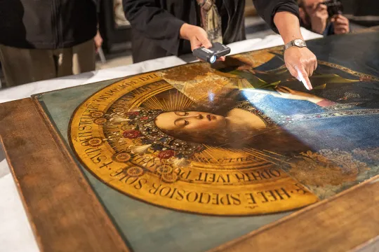 Conservators work on the third phase of the restoration of The Adoration of the Mystic Lamb ("Ghent Altarpiece") created by Belgian painters Hubert and Jan van Eyck in 1432, during a press review in Ghent, on May 2, 2023.
