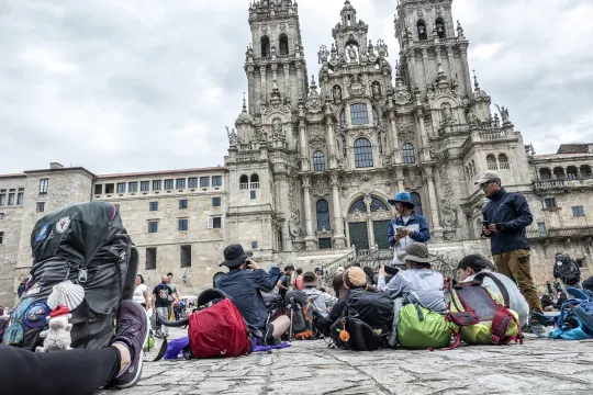 People gather at the end of their pilgrimage in the Obradoiro Plaza, in front of the Santiago de Compostela’s Cathedral, in Santiago de Compostela, Galicia, Spain, 12 June 2023. The St James Way, also known as the ‘Way of Saint James’ is one of the most ancient and popular pilgrimage routes in the world since the XI century. Often referred to as the Camino de Santiago, this Way takes pilgrims through many different routes across Spain, France and Portugal and culminates in the city of Santiago de Compostela