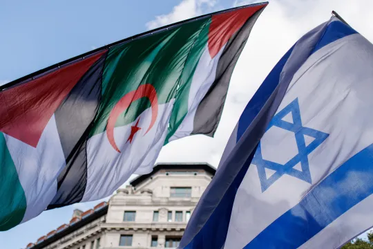 Flags of pro-Palestinian and counter pro-Israeli demonstrators are seen together during a march to Downing Street to mark one year of the Israeli operations in the Gaza Strip and to call for a permanent ceasefire as part of an event organised by the Palestine Solidarity Campaign in London, Britain, 05 October 2024.
