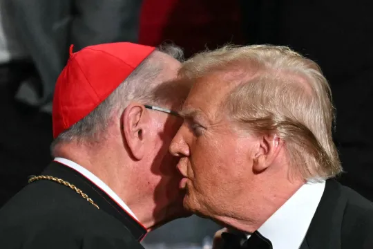 Former US President and Republican presidential candidate Donald Trump (R) chats with Archbishop of New York Timothy M. Dolan during the 79th Annual Alfred E. Smith Memorial Foundation Dinner at the Hilton Midtown in New York, October 17, 2024. TIMOTHY A. CLARY / AFP
