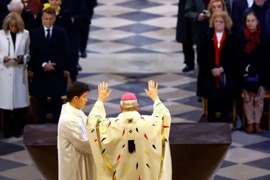 Paris' Archbishop Laurent Ulrich blesses the altar as French President Emmanuel Macron and his wife Brigitte Macron look on during the inaugural Mass at the Notre-Dame de Paris Cathedral in Paris, France, 08 December 2024. The Notre Dame de Paris Cathedral reopened on 07 December after nearly six years of renovation work following its destruction by a fire on 15 April 2019. EPA