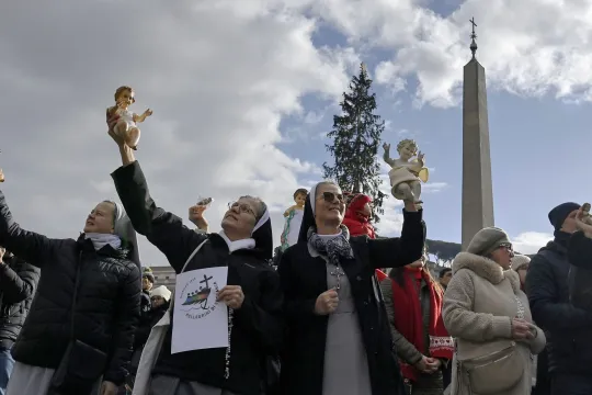 Nuns and faithfuls hold figurines of baby Jesus as Pope Francis leads his Sunday Angelus prayer from Santa Marta Chapel in Saint Peter's Square, Vatican City, 22 December 2024. EPA/Riccardo Antimiani