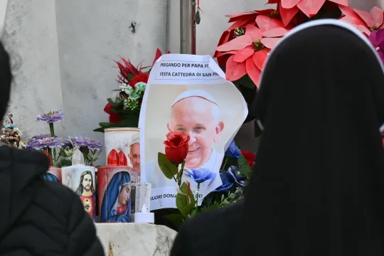 Nuns pray at the statue of John Paul II outside the Gemelli hospital where Pope Francis is hospitalized for pneumonia, in Rome on February 23, 2025. Pope Francis had a quiet night in hospital, the Vatican said on February 23, 2025, the morning after revealing the 88-year-old was in a "critical" condition. "The night passed peacefully, the pope rested," the Holy See said in a short update.
