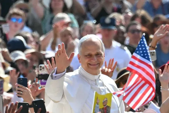 Pope Leo XIV waves to the crowd during the weekly general audience at St Peter's Square in The Vatican on June 18, 2025. Andreas SOLARO / AFP