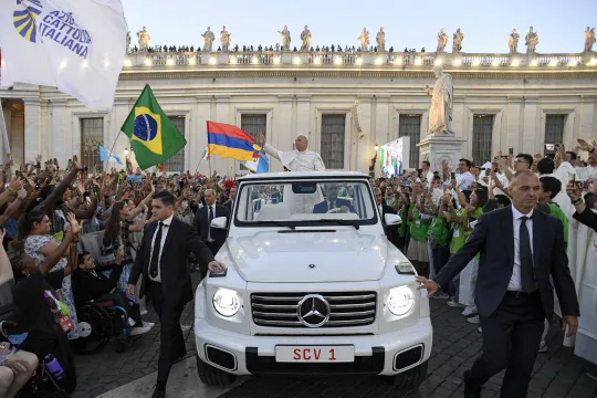 This handout photo taken on July 29, 2025 and released by the Vatican press office, Vatican Media, shows Pope Leo XIV waving as he unexpectedly arrives in the Pope Mobile to greet pilgrims waiting in St. Peter's Square, for the launching of the Youth Jubilee Mass at the Vatican. Tens of thousands of young Catholics from all over the world gathered on July 29, 2025, in Rome for a week of pilgrimage during the Vatican's Jubilee of Youth -- an event that takes place every 25 years. VATICAN MEDIA / AFP