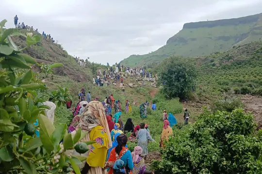 This handout image made available by the Sudan Liberation Movement/Army (SLM), on September 1, 2025, shows people inspecting the debris after a landslide devastated the village of Tarasin in Sudan's Jebel Marra area. A massive landslide in Sudan's western Darfur region has flattened an entire mountain village and killed more than 1,000 people, the Sudan Liberation Movement/Army (SLM) group said, leaving only one survivor. SUDAN LIBERATION MOVEMENT/ARMY / AFP