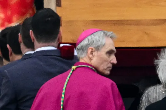 Pallbearers, followed by German Archbishop Georg Gaenswein (C), carry away the coffin of Pope Emeritus Benedict XVI at the end of his funeral mass at St. Peter's square in the Vatican on January 5, 2023. Pope Francis is presiding on January 5 over the funeral of his predecessor Benedict XVI at the Vatican, an unprecedented event in modern times expected to draw tens of thousands of people. Vincenzo PINTO / AFP