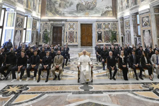 This photo taken and handout on May 27, 2025 by Vatican Media shows Pope Leo XIV (C) during a meeting with the managers and players of the Napoli football team in the Vatican. SIMONE RISOLUTI / VATICAN MEDIA / AFP