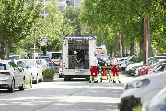 Rescue paramedics are seen next to an ambulance car close to a school where, according to reports, several people died in a shooting, on June 10, 2025 in Graz, southeastern Austria. Several people died in a school shooting, including the attacker, Austrian broadcaster ORF quoted the interior ministry as saying. ERWIN SCHERIAU / APA / AFP