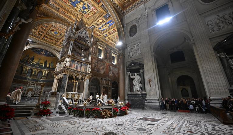 Priests take part in a mass to pray for the health of Pope Emeritus Benedict XVI inside the Basilica of Saint John Lateran in Rome on December 30, 2022. The Rome diocese celebrated a special mass for Benedict at the Basilica of St. John Lateran on December 30, 2022, and in his homily, Cardinal Angelo De Donatis said as "priest, theologian, bishop, pope", Benedict "expressed at the same time, the strength and the sweetness of faith." Filippo MONTEFORTE / AFP