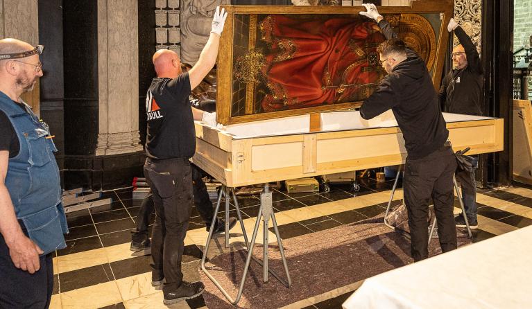 Conservators work on the third phase of the restoration of The Adoration of the Mystic Lamb ("Ghent Altarpiece") created by Belgian painters Hubert and Jan van Eyck in 1432, during a press review in Ghent, on May 2, 2023. The panels of the upper register of the inner panels in the cathedral will be dismantled and transferred to the Museum of Fine Arts in Gent. 'Het Lam Gods' Altarpiece (The Adoration of the Mystic Lamb) of Hubert and Jan van Eyck, is at the Sint-Baafs Cathedral (St Bavo's Cathedral) in Ghen