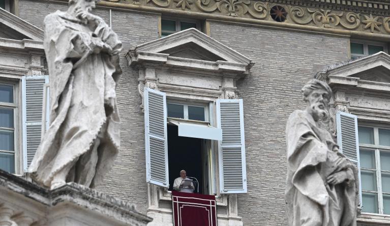 Pope Francis addresses the crowd during his Angelus prayer from the window of the apostolic palace overlooking St Peter's Square at the Vatican on January 15, 2023.  VINCENZO PINTO / AFP