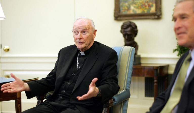 US President George W. Bush (R) meets with Cardinal Theodore McCarrick (L), Archbishop of Washington, DC, 01 December 2005 in the Oval Office of the White House in Washington, DC