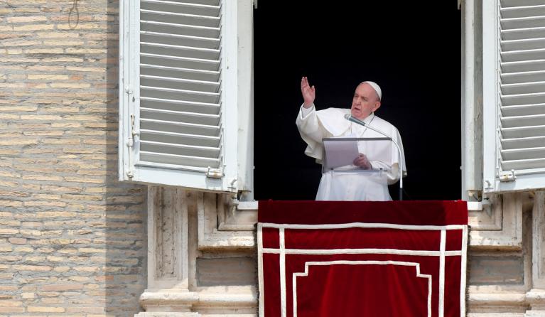 Pope Francis speaks from the window of the apostolic palace overlooking St. Peter's Square on May 30, 2021 in The Vatican during the weekly Angelus prayer.  Alberto PIZZOLI / AFP