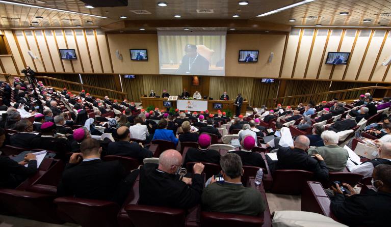 This handout picture taken and released on October 9, 2021 by Vatican Media shows Pope Francis (C) during the opening of the Synod at the Vatican. 