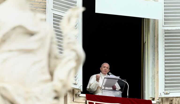Pope Francis speaks from the window of the apostolic palace overlooking St. Peter's square in the Vatican during the weekly Angelus prayer on June 06, 2021.  VINCENZO PINTO / AFP