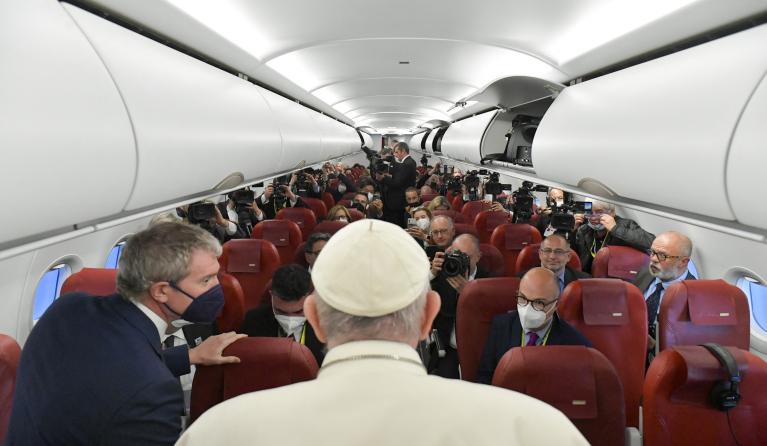 This photo taken and handout on April 3, 2022 by The Vatican Meida shows Pope Francis speak to journalists aboard the papal plane on his way back from Malta to Rome's Fiumicino airport following a two-day trip to the Mediterranean archipelago.