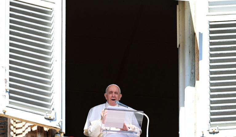 Pope Francis delivers his message from the window of the apostolic palace overlooking St. Peter's Square, as he holds his weekly Angelus prayer in The Vatican on October 24, 2021.  