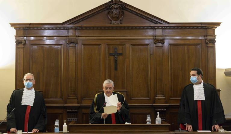 This photo taken and handout on January 21, 2021 by the Vatican Media shows magistrates during the trial of former president of the IOR Vatican bank, Angelo Caloia (not in picture) on embezzlement charges at the Vatican courthouse. Angelo Caloia, a former head of the Vatican bank, was on January 21, 2021 found guilty of embezzlement and money laundering and sentenced to eight years and 11 months in prison. Handout / VATICAN MEDIA / AFP