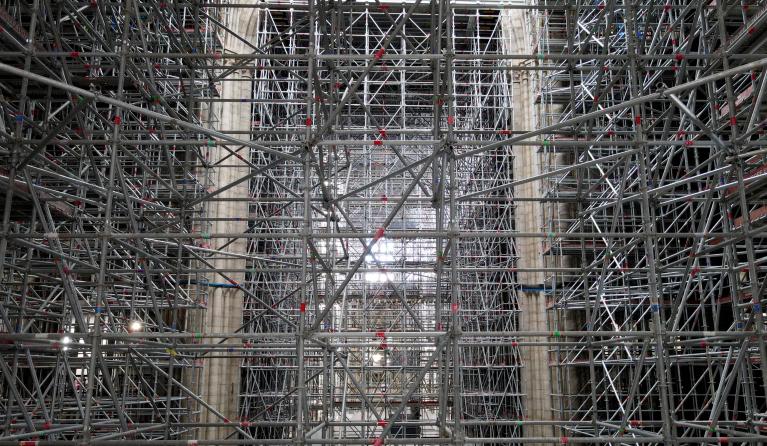 This aerial view taken on September 16, 2021, shows scaffolding in Notre-Dame de Paris, in Paris, more than two years after the blaze that made the spire collapsed and destroyed much of the roof, in Paris on April 15, 2021. The phase of securing and consolidating the cathedral Notre-Dame de Paris, ravaged more than two years ago by fire, has ended, giving way to the restoration phase, announced on September 18, 2021, the public institution responsible for its conservation.