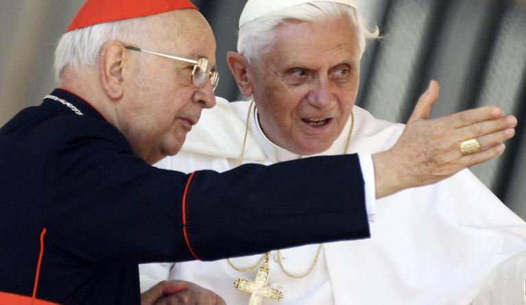 Pope Benedict XVI talks with Cardinal Eduardo Martinez Somalo of Spain (L) at the end of his weekly general audience in St. Peter's Square at the Vatican 31 May 2006. The Pontiff called on thousands of pilgrims at the Vatican on Wednesday to pray for the success of peace efforts in East Timor, where more than 2,000 foreign troops have been deployed to help restore order. 