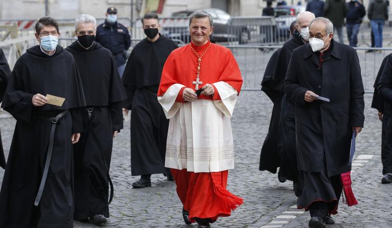 Maltese newly appointed Cardinal Mario Grech (C) arrives for a consistory ceremony in the Saint Peter's basilica at the Vatican, 28 November 2020. Pope Francis installed 13 new Cardinals, including the first African-American.