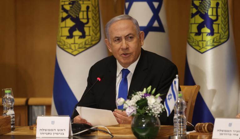 Israeli Prime Minister Benjamin Netanyahu, wearing a mask for protection against the COVID-19 pandemic, attends a special cabinet meeting on the occasion of "Jerusalem Day" at the city's municipality building on May 9, 2021. Clashes have repeatedly broken out over the past week in east Jerusalem's Sheikh Jarrah neighbourhood, fuelled by a years-long attempt by Jewish settlers to take over Palestinian homes. Israel's Supreme Court is to hold a new hearing in the case on Monday, when Israelis mark Jerusalem D