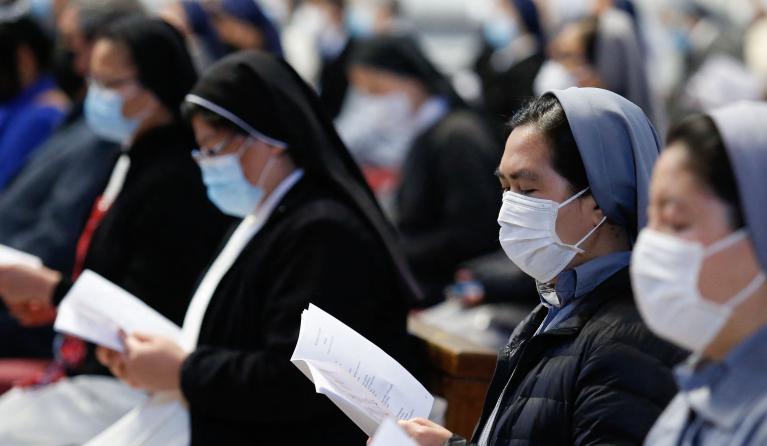Members of the community of Rome's faithful of Myanmar attend a Pope's mass on May 16, 2021 at St. Peter's Basilica in The Vatican. 