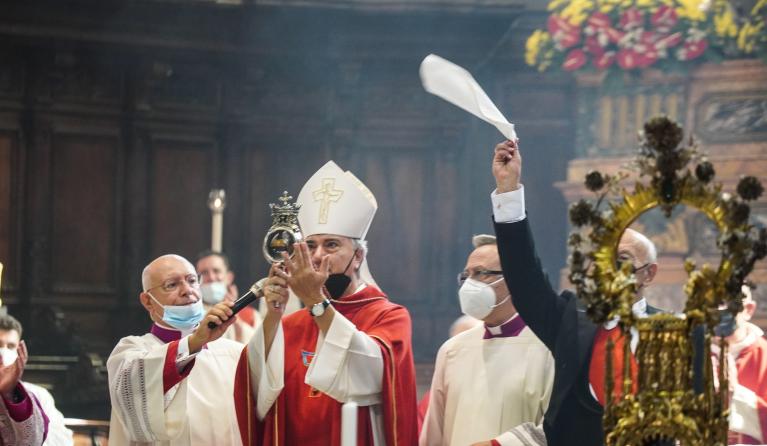 The archbishop of Naples Domenico Battaglia holds a vial believed to contain the blood of the 3rd century saint San Gennaro (Saint Januarius) during the so-called liquefaction miracle, in the Chapel of the Treasury, in Naples, Italy, 19 September 2021. Faithful gather three times a year to witness the liquefaction of the otherwise coagulated blood of the saint. EPA/CESARE ABBATE