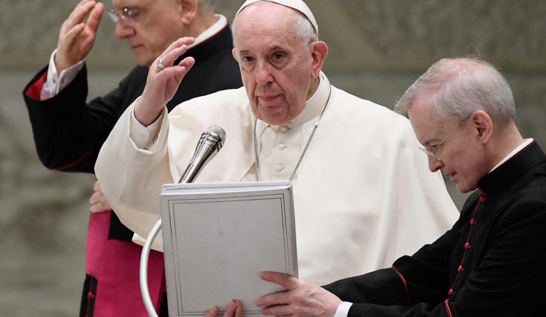Pope Francis, flanked by Italian priest, Monsignor Leonardo Sapienza (L) and Argentinian priest, Monsignor Luis Maria Rodrigo Ewart, blesses attendees during the weekly general audience on October 6, 2021 at Paul-VI hall