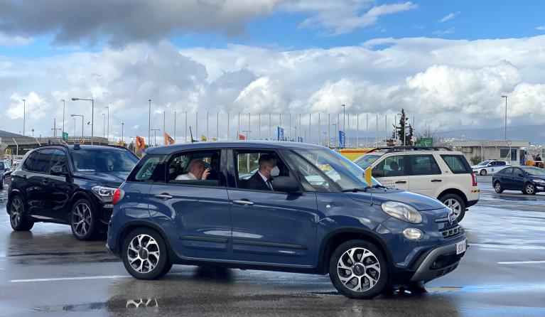 Pope Francis leaves in a car upon his arrival in Athens airport on December 4, 2021. Pope Francis began a landmark trip to Greece with the first visit to Athens by a pontiff in two decades, aiming to improve relations with the Orthodox Church of Greece and highlight the plight of refugees.